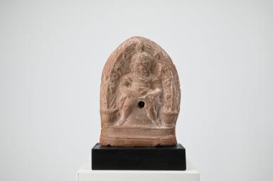 Relief: Priapos zwischen Palmen